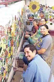 Piece by Piece artists installing the mosaic.