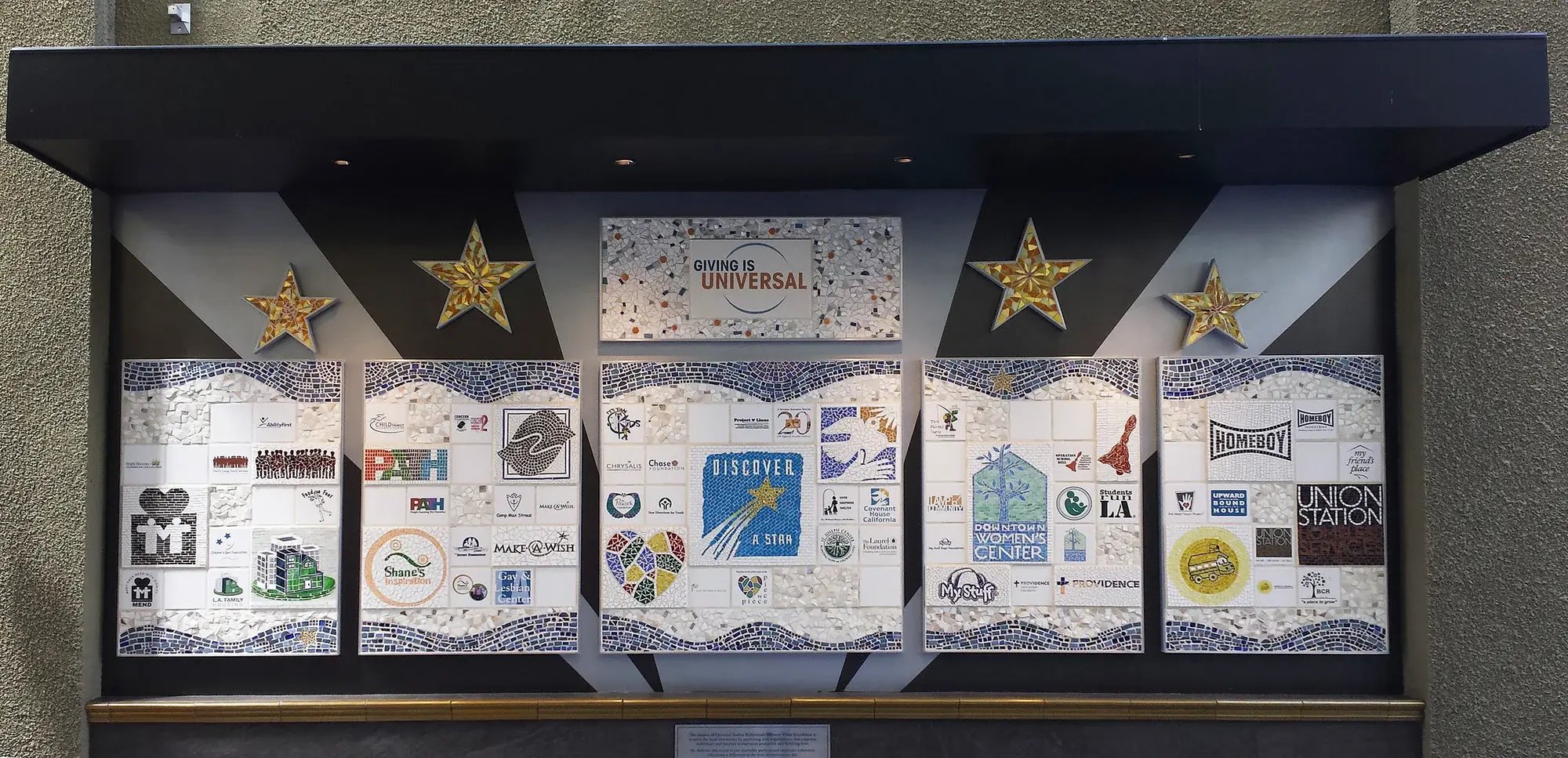 The completed Giving is Universal mosaic.