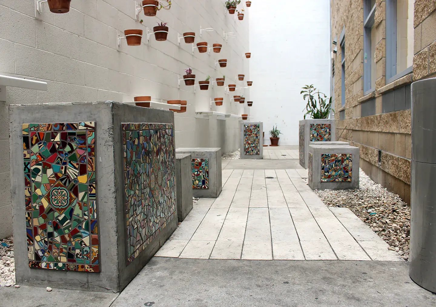 Colorful mosaics in the outdoor area of the Weldon apartments.