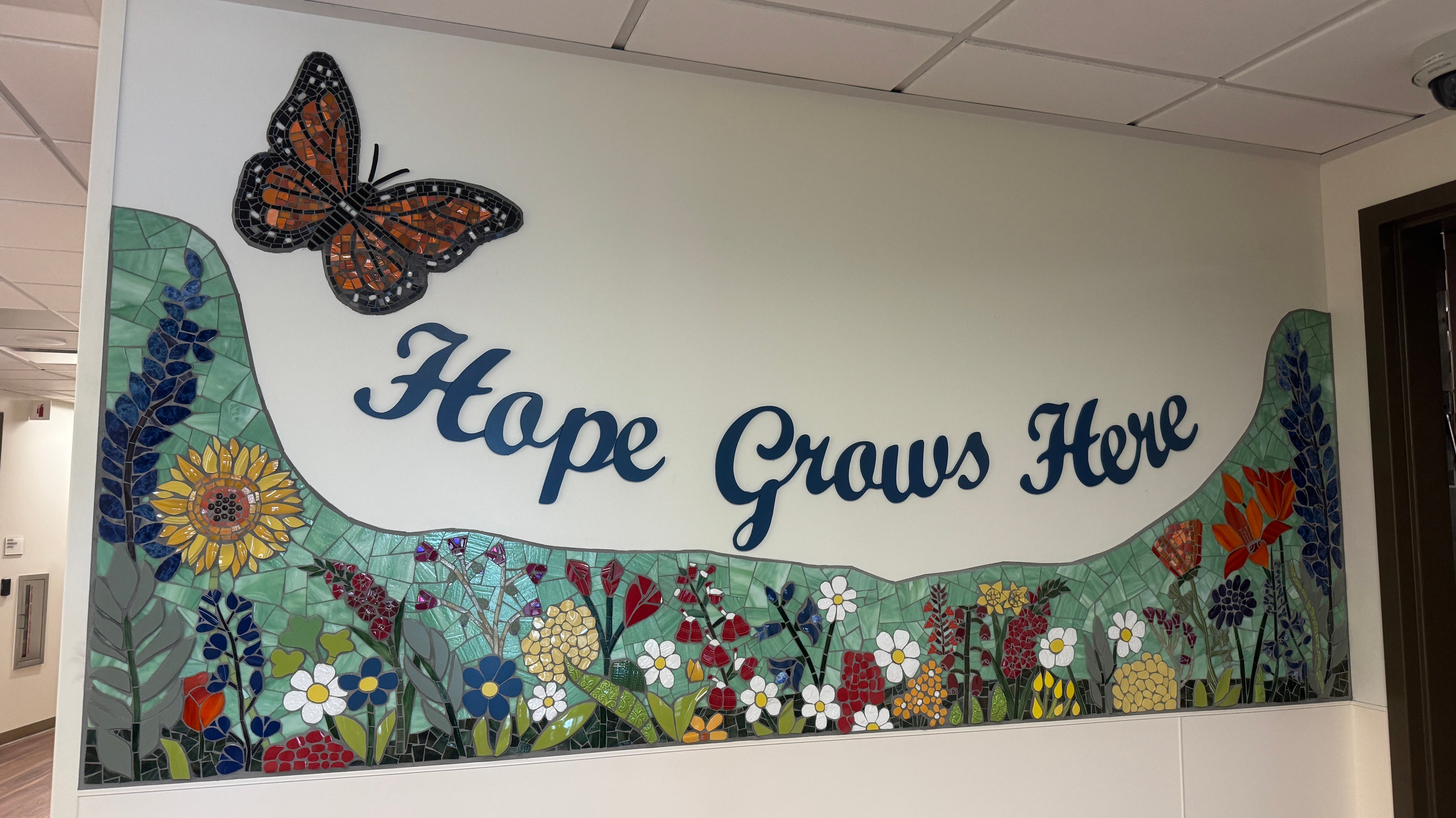 Completed mural hope grows here