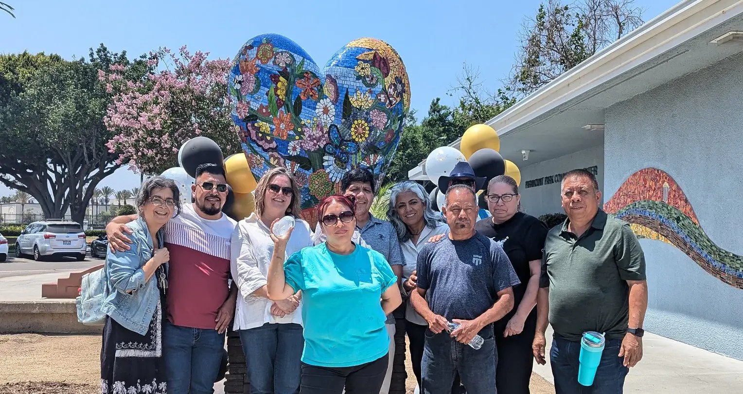 City of Paramount Heart Mosaic with artists standing in front of the completed and installed mosaic.